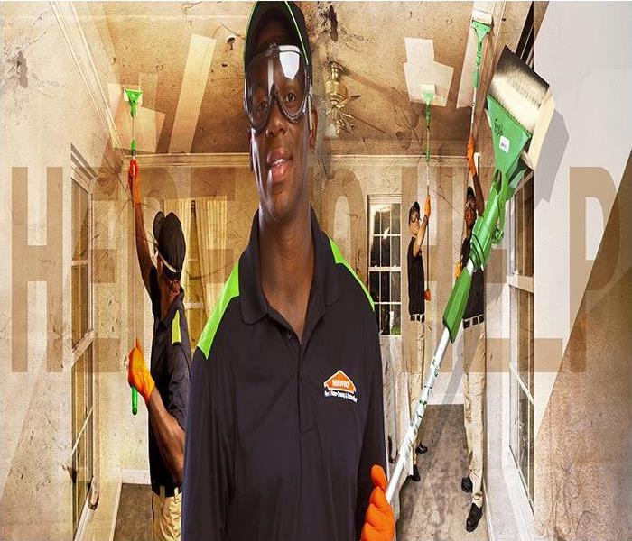 SERVPRO professional front center holding a broom. Duplicates of him to the left and right side cleaning the roofs from smoke
